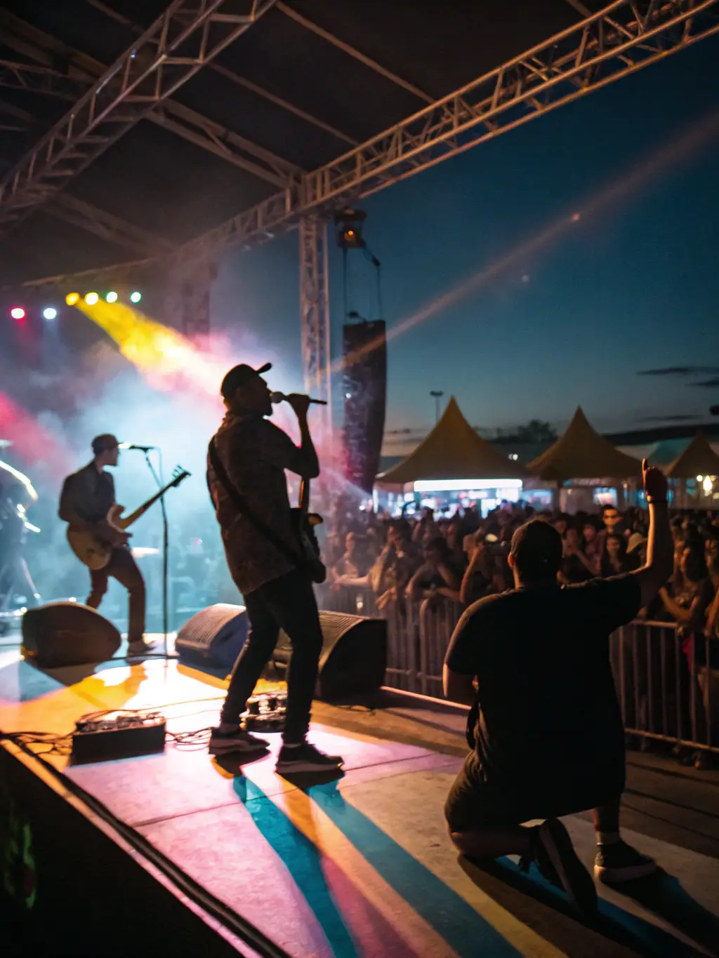 A dynamic image of a local music festival organized by MAKUSSA, featuring a diverse lineup of musicians performing on stage, with an enthusiastic crowd enjoying the music and atmosphere.
